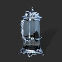 An arts and crafts silver and enamel gothic style tankard