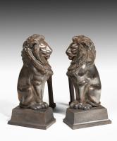 Pair of bronze lion and irons after Alfred Stevens