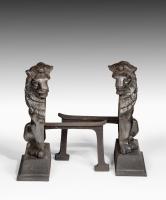 Pair of bronze lion and irons after Alfred Stevens