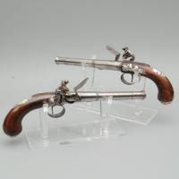 A Rare Pair of Silver Mounted Queen Anne Pistols