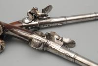 A Rare Pair of Silver Mounted Queen Anne Pistols