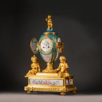 A Louis XVI Style Gilt-Bronze and Sèvres Style Porcelain Mantel Clock, by Raingo Frères, Paris.