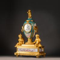 A Louis XVI Style Gilt-Bronze and Sèvres Style Porcelain Mantel Clock, by Raingo Frères, Paris.