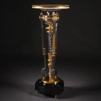 Louis XVI style gilt-bronze and polished steel pedestal table