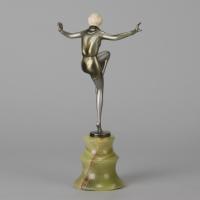 Art Deco Cold Painted Bronze and Ivory Sculpture entitled "Arms Out" by Lorenzl