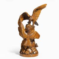 A ‘Black Forest’ carving of two quarrelling golden eagles