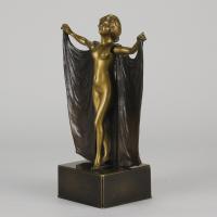 Gilt and Patinated Early 20th Century Bronze Sculpture entitled "Cloaked Lady - Circa 1900