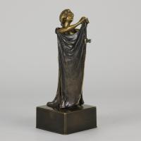 Gilt and Patinated Early 20th Century Bronze Sculpture entitled "Cloaked Lady - Circa 1900