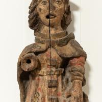 A close up of the middle of a 16th century carved figure