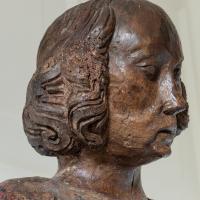 Detail of the face of a carved walnut figure