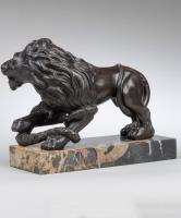 Pair of cast iron lion and serpent sculptures