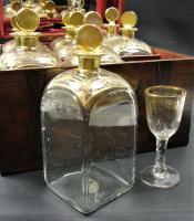 inlaid mahogany box containing nine decanters
