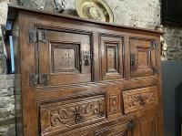 A MAGNIFICENT AND RARE HENRY VIII ENGLISH OAK AUMBRY