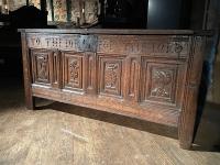A RARE HENRY VIII OAK INSCRIBED PANELLED CHEST