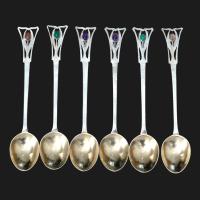 A Guild of Handicraft set of six silver gem set spoons in their original box