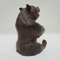 A Black Forest seated carved bear as a tobacco jar