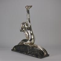 Early 20th Century Italian Silvered Bronze Sculpture entitled "Woman with Dove" by Amadeo Gennarelli