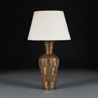 An Arts and Crafts Hammered Copper Lamp