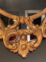 George III carved gilt rococo oval border mirror