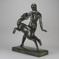 Early 20th Century Art Deco Bronze Sculpture entitled "Deer and Nymph" Pierre Traverse