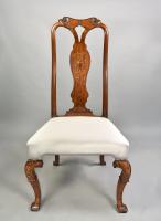 Pair of early eighteenth century walnut chairs with marquetry panels, c.1720