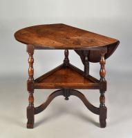 A rare early eighteenth century oak cricket table, c.1720