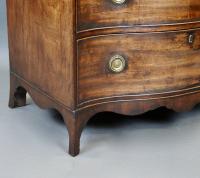 Hepplewhite period mahogany three drawer serpentine chest