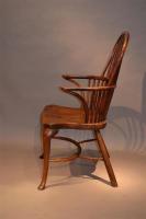 An 18th century yew wood double bow armchair