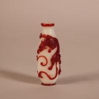 Qing snuff bottle with red overlay