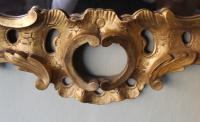 carved and gilt wood mirror in the manner of Matthias Lock (circa 1710 – 1765)