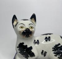 Staffordshire pottery recumbent cats