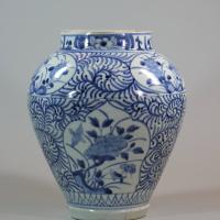 Front of one of a pair of Japanese blue and white baluster vases