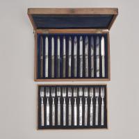 An unusual, complete set of knives and forks with Japanese handles and Chinese forks and blades
