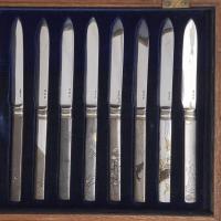 An unusual, complete set of knives and forks with Japanese handles and Chinese forks and blades