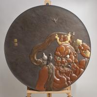 A monumental Japanese late 19th Century Iron and multi-metal charger depicting a Temple Guardian