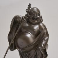 A characterful Japanese Meiji-era Bronze Okimono depicting Hotei (Circa 1900)