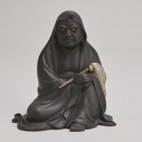A powerful late 19th Century Japanese Bronze Okimono depicting Daruma (Circa 1880)
