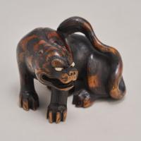 A fantastic Japanese late 19th Century wood Netsuke in the form of a Tiger