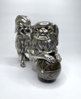 Silvered bronze okimono of a Chin puppy, Japan, Meiji Period