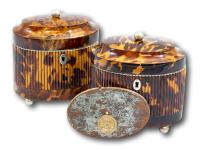 Overview of the two tortoiseshell tea caddies showing the retailers label