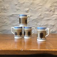 Four mocha-ware pint mugs