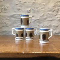 Four mocha-ware pint mugs