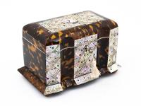 Front of the tortoiseshell and mother of pearl tea caddy with the key inserted