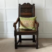 A cushion faced with a needlework panel, Italian, circa 1700