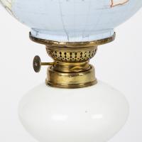 Oil lamp with an illuminating globe shade by Stelzig, Kittel & Co