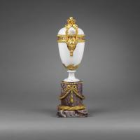 A Pair of Louis XVI Ormolu-Mounted White Locre Porcelain Vases and Covers Resting on later Amethyst Bases. Circa 1775