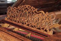 Steinway music desk in an arabesque design with central lyre motif