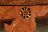 Carved sunflower on piano pediment