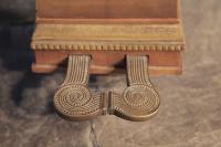 Spiral piano pedals with studded embellishment 